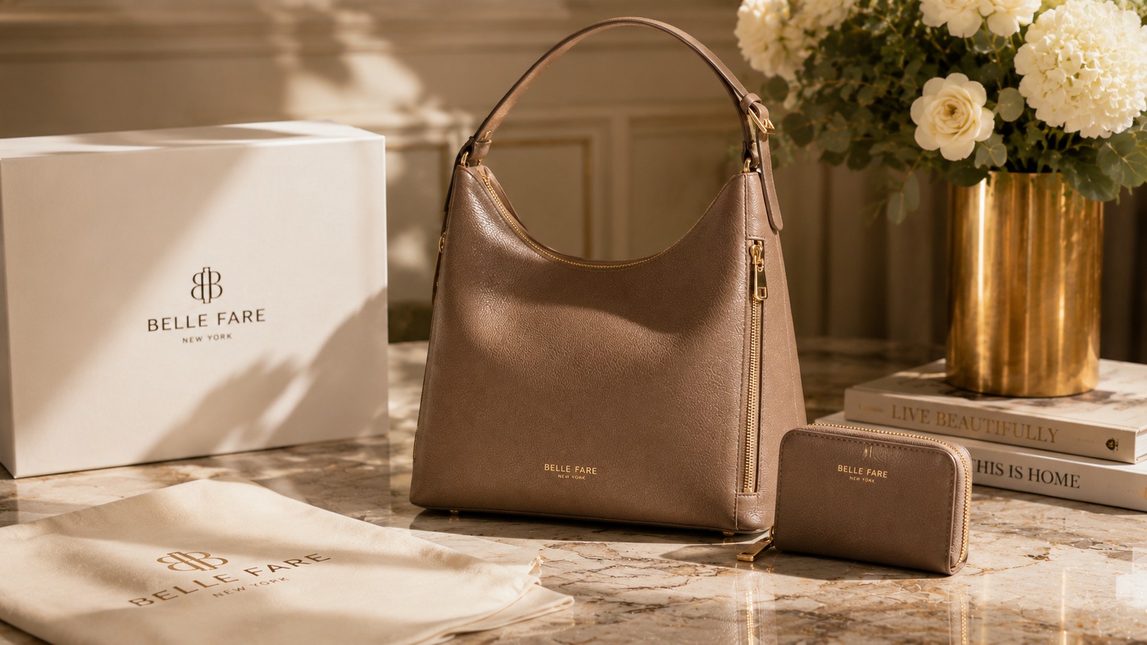 Belle Fare sponsored campaign — taupe leather hobo bag and matching zip wallet with gift box and dust bag on marble